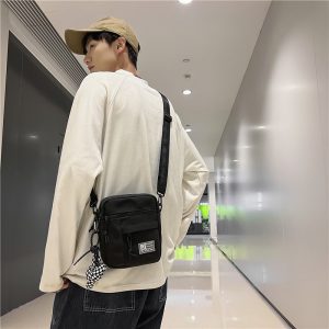O1CN016800so1DMYlxK7VAw_2214158730202-0-cib 街头潮流情侣小挎包女ins韩版时尚休闲帆布包男士出街手机单肩包