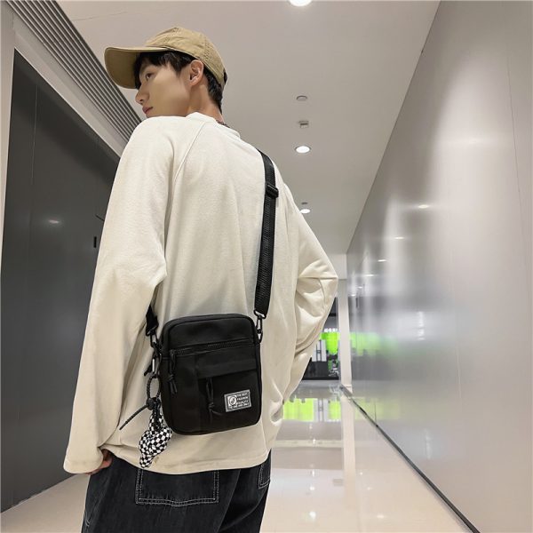 街头潮流情侣小挎包女ins韩版时尚休闲帆布包男士出街手机单肩包