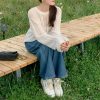 2025新款温柔风韩系上衣慵懒设计感小众女白色针织罩衫长袖针织衫