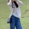 2025新款温柔风韩系上衣慵懒设计感小众女白色针织罩衫长袖针织衫