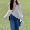 2025新款温柔风韩系上衣慵懒设计感小众女白色针织罩衫长袖针织衫