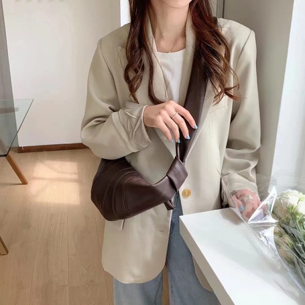 2024新款复古小众可颂牛角包牛皮饺子包真皮时尚单肩斜挎法棍女包